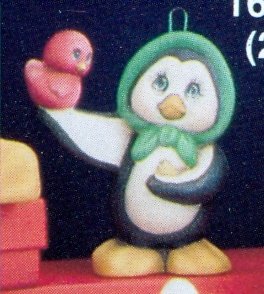 penguin with bird ornament penguin with bird ornament