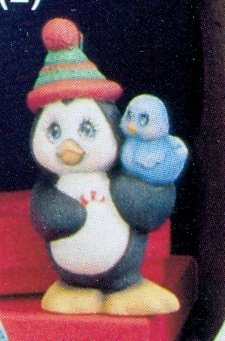 penguin with bird ornament penguin with bird ornament