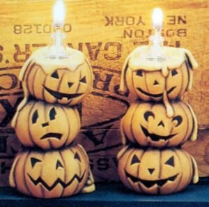 two pumpkin oil lamps